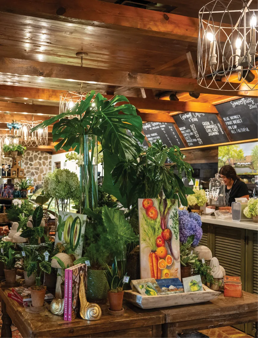 inside local farmers market with trees and paintings