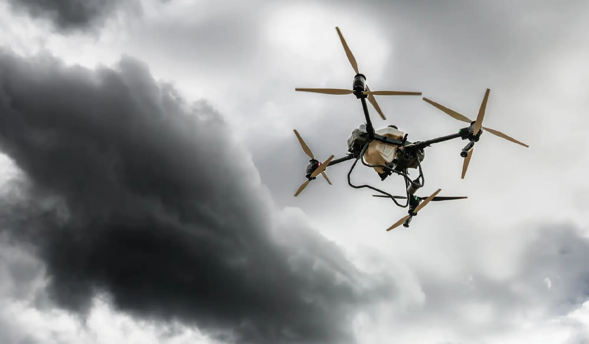 Drone flying through dark storm clouds.